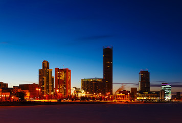 Fototapeta premium sunset glow of the night and in the winter over the center of Yekaterinburg