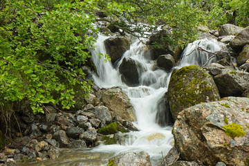 Fototapeta na wymiar small waterfall of a stream