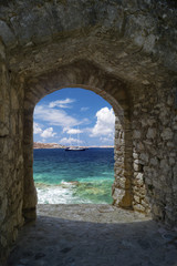 Traditional ship through old castle on Santorini island, Greece