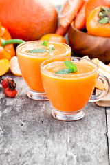 fresh  healthy pulpy cocktail with orange fruits and berries and