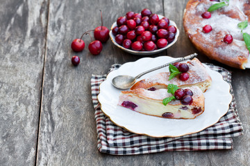 pieces  of cranberry cheesecake tart on a wooden table