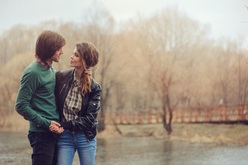 loving couple happy together outdoor on  rainy walk on country side, cozy mood