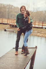 loving couple happy together outdoor on  rainy walk on country side, cozy mood