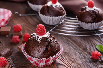 Delicious cupcakes with berries on table close up