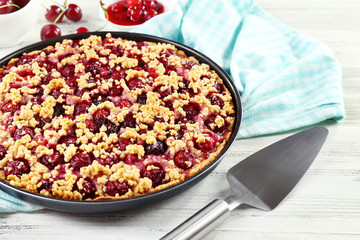 Tasty homemade pie with cherries on table close up