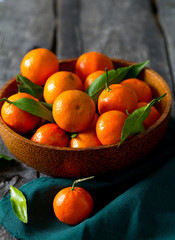 mandarines in a wooden bowl