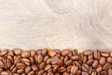 Coffee beans on the table. Free space for your text.