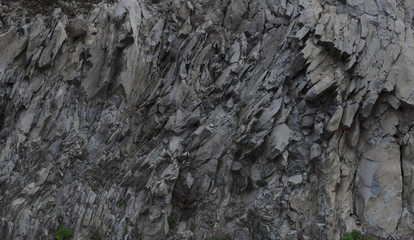 grey rock mountain panorama background - stone texture