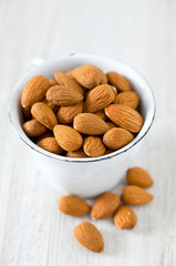 almonds on wooden surface