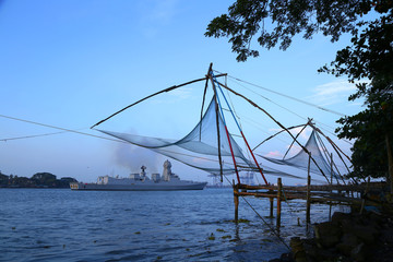 Chinese Fishing Nets with a Ship on Background at Fort Cochin.