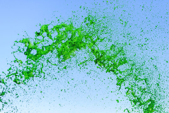 Green splash on sky background © styf