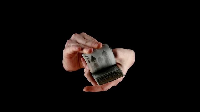 Shuffling the cards, on black, slow motion
