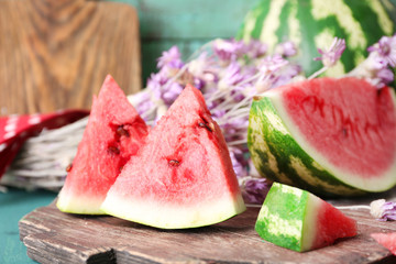 Sliced watermelon on decorated wooden background