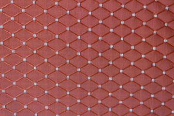 red fabric background with tiled decor - textile texture