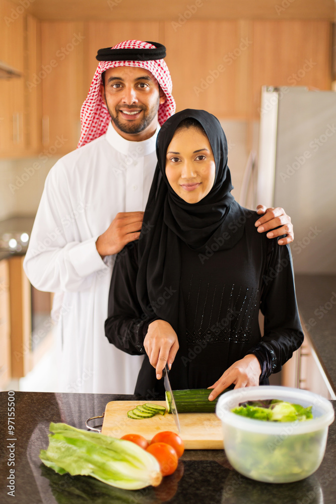 Wall mural Arabian couple in kitchen