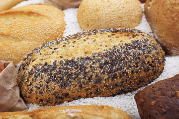 Mixed breads and grains background, close up