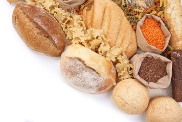 Composition of mixed breads, macaroni and grains on white background