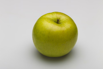 Green apple on a white background