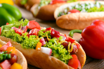 Hot dogs and vegetables on craft paper closeup