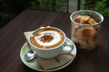 Cup of coffee with cookie for serve