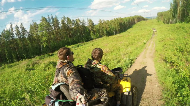 Two Man on ATV in forest video Selfe