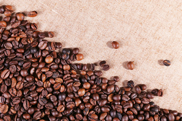 Roasted coffee beans on the linen fabric