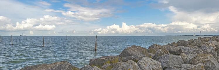 Dike along a lake in summer