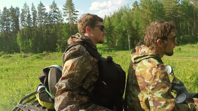 Two Man on ATV in forest video Selfe