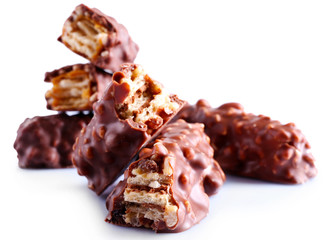 Broken crispy candy bars, isolated on white