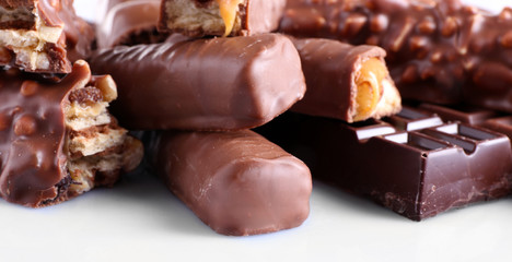 Mix of chocolate bars on table, close-up