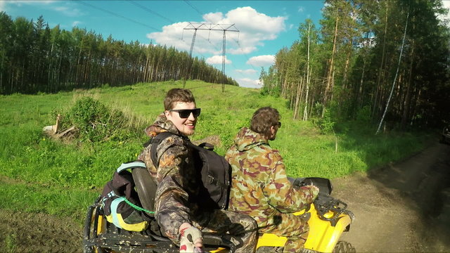 Two Man on ATV in forest video Selfe