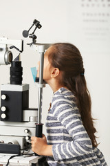 Small girl visit an optician