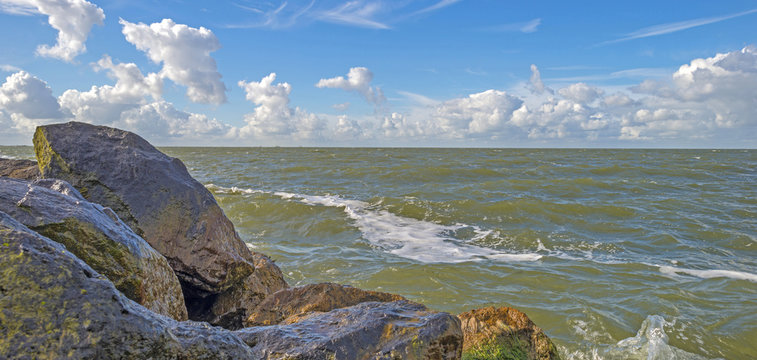 Dike along a lake in summer