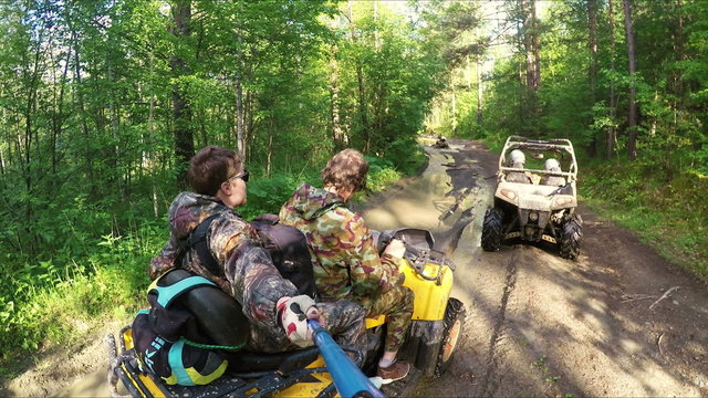 Two Man on ATV in forest video Selfe