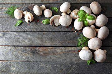 Fresh mushrooms on wooden background