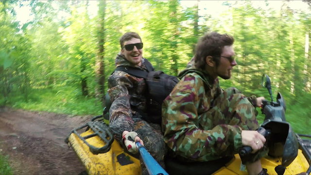 Two Man on ATV in forest video Selfe