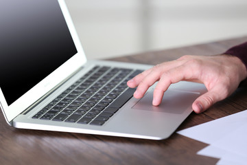 Man working with laptop in office