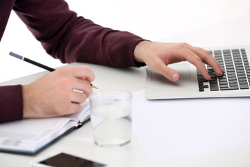 Businessman working with laptop in office