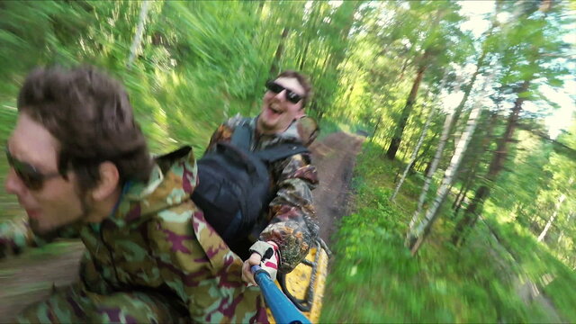 Two Man on ATV in forest video Selfe