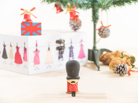 Royal British Guard On Present Box With Christmas Tree Backgroun