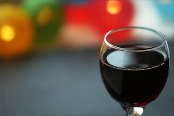 A glass of red wine on blurred background