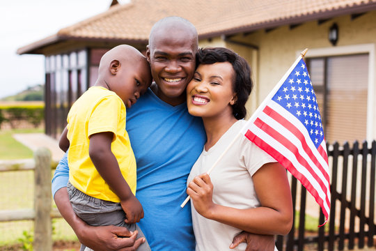 african american family holding usa flag