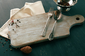 Spices and kitchenware on dark wooden background