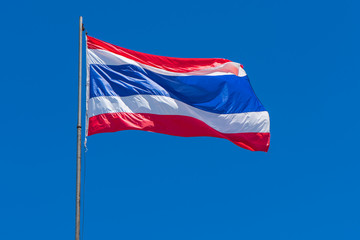 Thai flag of Thailand with blue sky background