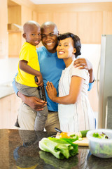 afro american family in home kitchen