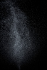 Abstract splashes and drops of water on black background.