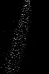 Abstract splashes and drops of water on black background.