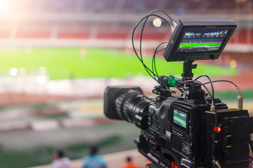 Fototapeta na wymiar video camera recording in a football game