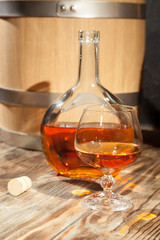 Glass of cognac and a bottle