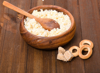 Rural meal from millet cereal in a wooden bowl, steering-wheels